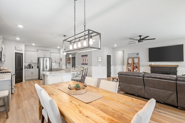 627 Macintyre Cir, Summerville, SC 29486 - dining area with a ceiling fan, wainscoting, recessed lighting, and light wood finished floors