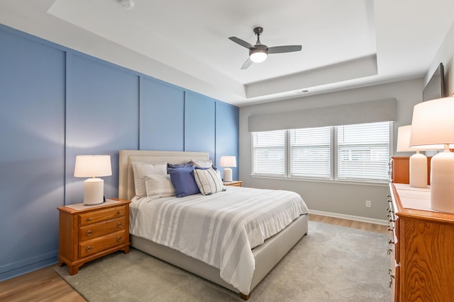 627 Macintyre Cir, Summerville, SC 29486 - bedroom with a raised ceiling, light wood-style flooring, baseboards, and ceiling fan
