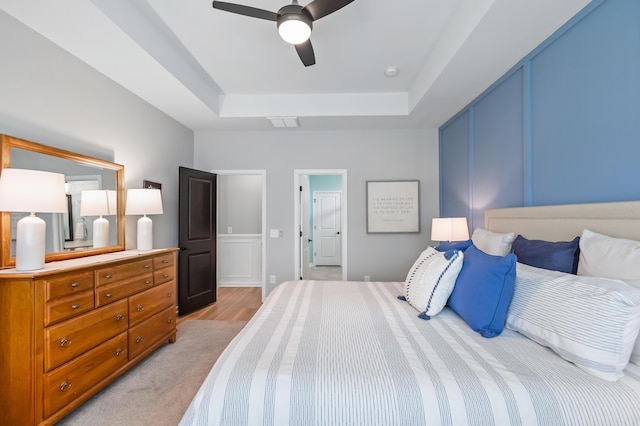 627 Macintyre Cir, Summerville, SC 29486 - bedroom featuring a tray ceiling, ceiling fan, and light wood-type flooring