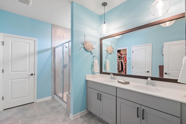 627 Macintyre Cir, Summerville, SC 29486 - full bathroom with a stall shower, double vanity, a spacious closet, and baseboards
