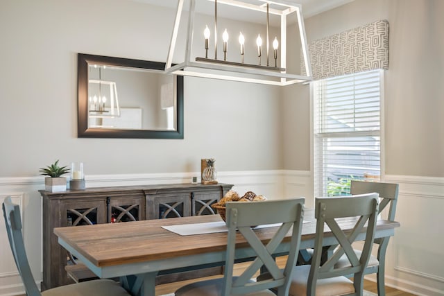 627 Macintyre Cir, Summerville, SC 29486 - dining area featuring a chandelier, a wainscoted wall, and a decorative wall