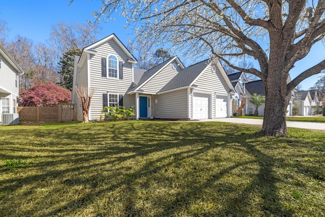 traditional-style home featuring a garage, a front yard, central AC, and fence