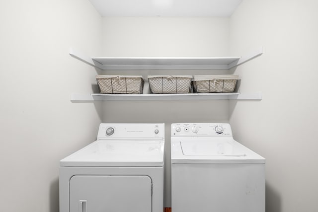 laundry area with laundry area and washing machine and clothes dryer