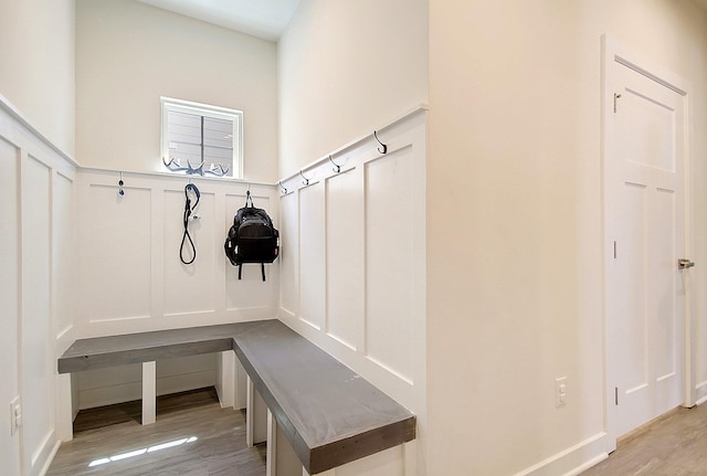 mudroom with light hardwood / wood-style floors