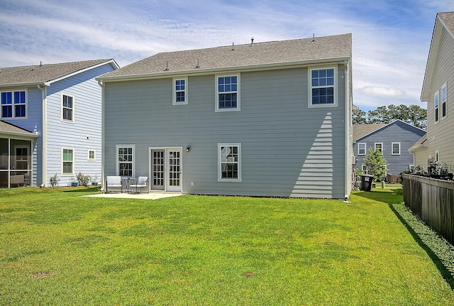 back of house featuring a patio area and a yard