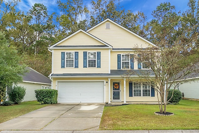 view of front of property featuring a garage and a front yard