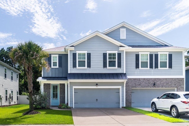 1630 Mermentau St, Mount Pleasant, SC 29466 - view of front of property featuring a garage, concrete driveway, brick siding, a front yard, and board and batten siding