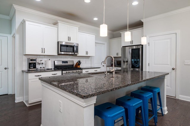 1630 Mermentau St, Mount Pleasant, SC 29466 - kitchen with appliances with stainless steel finishes, dark wood-style floors, a breakfast bar, decorative backsplash, and recessed lighting