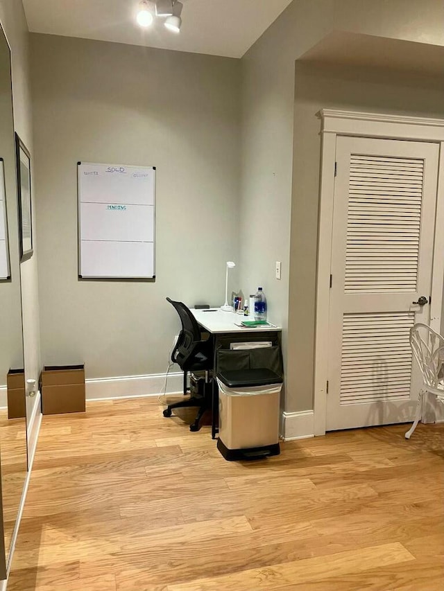 office space with light wood-type flooring