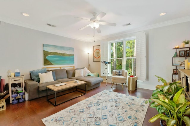 living room with ornamental molding, dark hardwood / wood-style floors, and ceiling fan