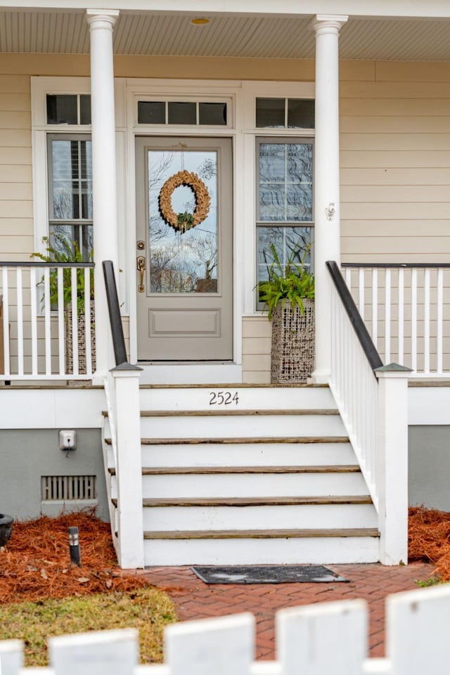 property entrance featuring covered porch