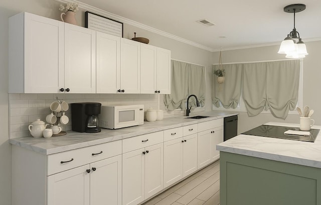 6061 Old Number Six Hwy, Elloree, SC 29047 - kitchen with white microwave, a sink, dishwasher, crown molding, and white cabinetry