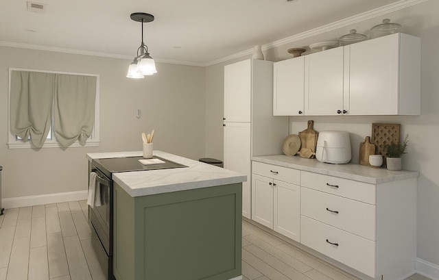 6061 Old Number Six Hwy, Elloree, SC 29047 - kitchen with a kitchen island, white cabinets, wood finish floors, crown molding, and baseboards