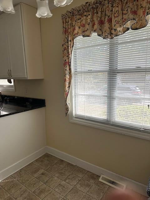 unfurnished dining area with plenty of natural light