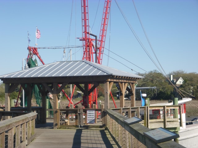 view of dock with a deck and a gazebo