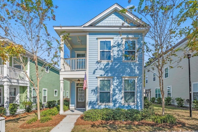 view of front of home featuring a balcony