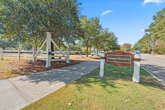 view of home's community with a lawn