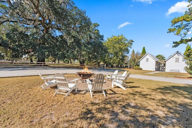 view of yard with a fire pit