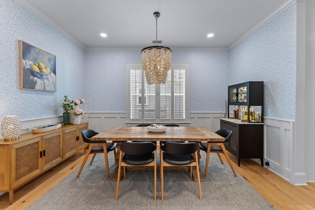 1530 Willtown St, Daniel Island, SC 29492 - dining area featuring ornamental molding, a chandelier, light wood finished floors, a wainscoted wall, and recessed lighting