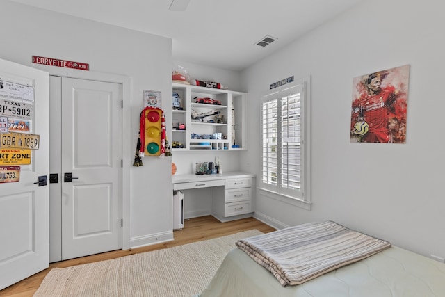 1530 Willtown St, Daniel Island, SC 29492 - bedroom with light wood-type flooring and built in desk