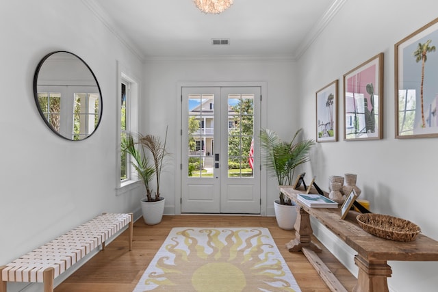 1530 Willtown St, Daniel Island, SC 29492 - foyer featuring light wood finished floors, crown molding, and french doors