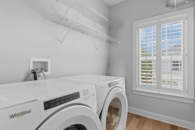1530 Willtown St, Daniel Island, SC 29492 - washroom with separate washer and dryer and wood finished floors