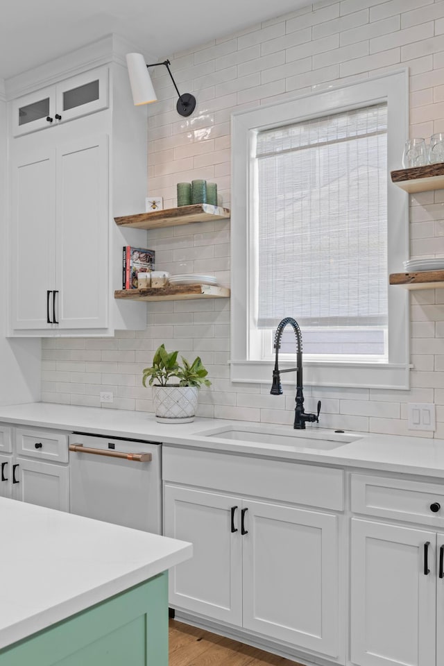 1530 Willtown St, Daniel Island, SC 29492 - kitchen with open shelves, decorative backsplash, light countertops, and white cabinetry