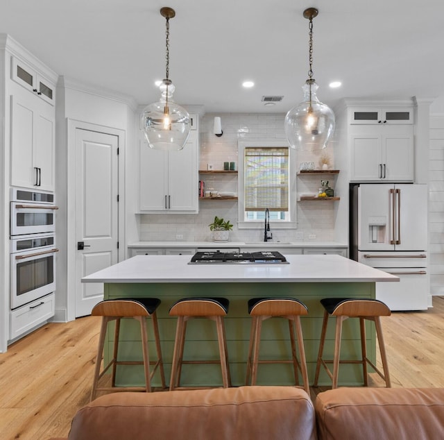 1530 Willtown St, Daniel Island, SC 29492 - kitchen featuring white appliances, open shelves, backsplash, a kitchen island, and ornamental molding