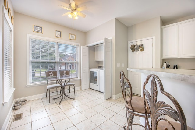 116 Holbrook Ln, Goose Creek, SC 29445 - kitchen with washer / dryer, white cabinetry, a ceiling fan, and baseboards