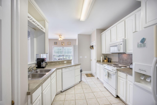 116 Holbrook Ln, Goose Creek, SC 29445 - kitchen featuring white appliances, a sink, light tile patterned flooring, and white cabinetry