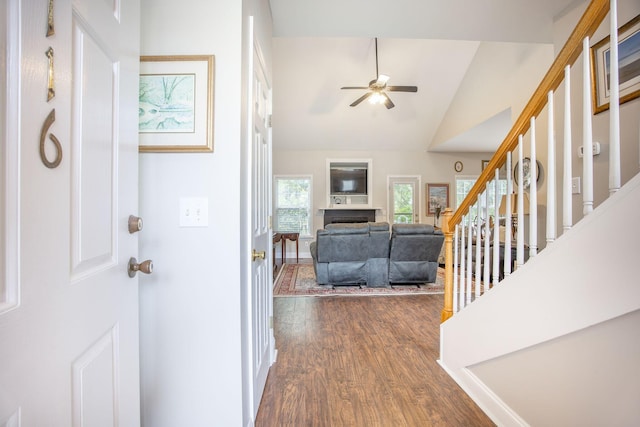 116 Holbrook Ln, Goose Creek, SC 29445 - foyer entrance featuring dark wood-type flooring, vaulted ceiling, ceiling fan, stairs, and a fireplace