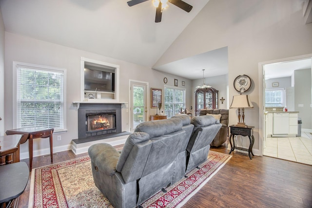 116 Holbrook Ln, Goose Creek, SC 29445 - living room with ceiling fan, wood finished floors, a warm lit fireplace, healthy amount of natural light, and high vaulted ceiling