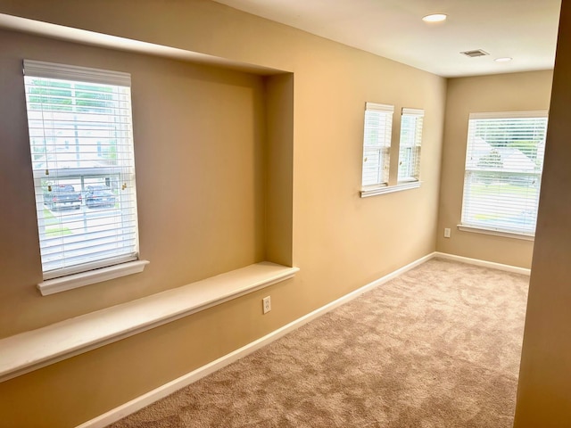 unfurnished room with carpet flooring, baseboards, and recessed lighting