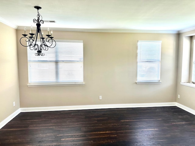 unfurnished room with a chandelier, crown molding, dark wood-style flooring, and baseboards