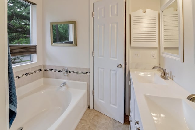 full bathroom with a bath, tile patterned floors, and double vanity