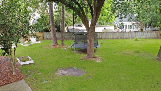 view of yard featuring a trampoline