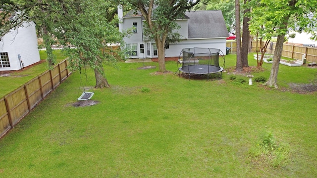 view of yard featuring a trampoline