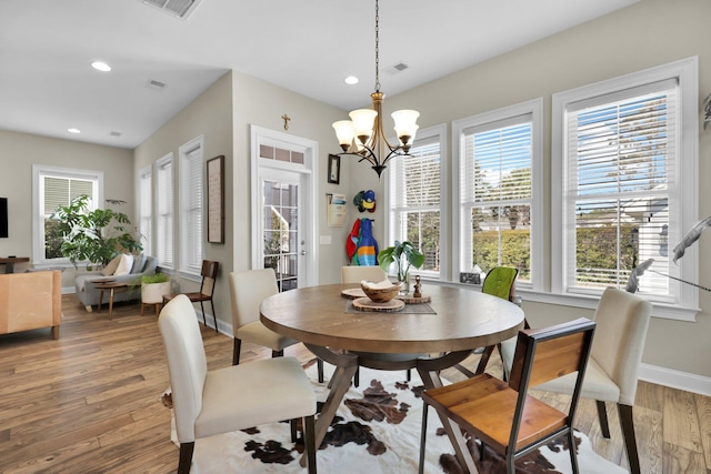 dining room featuring visible vents, baseboards, light wood-type flooring, a chandelier, and recessed lighting