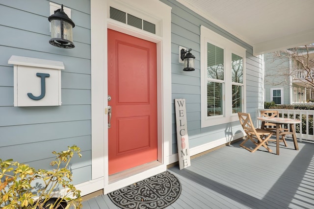 property entrance featuring covered porch