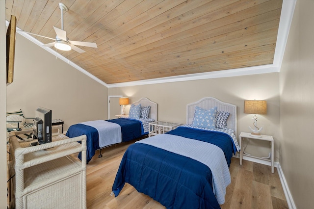 bedroom with ceiling fan, wooden ceiling, crown molding, light hardwood / wood-style floors, and vaulted ceiling