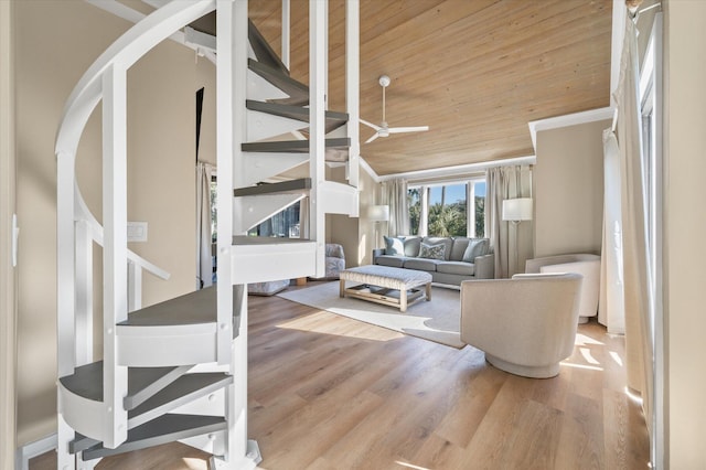 living room with ceiling fan, light wood-type flooring, wooden ceiling, and lofted ceiling