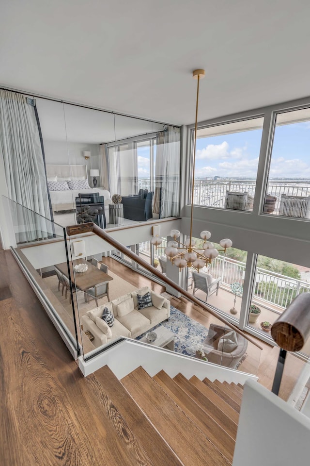 330 Concord St Unit 18F, Charleston, SC 29401 - living area featuring wood finished floors and a healthy amount of sunlight