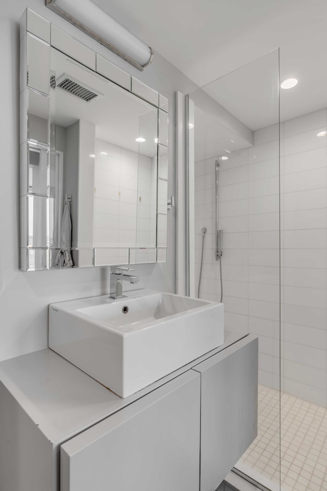 330 Concord St Unit 18F, Charleston, SC 29401 - bathroom with a stall shower, vanity, and visible vents