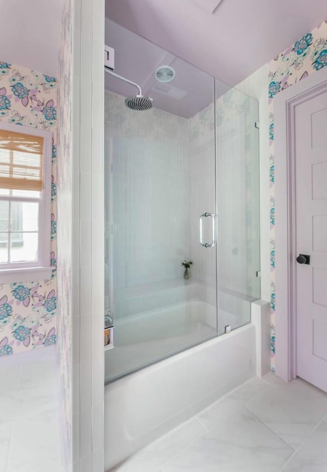 bathroom with shower / bath combination with glass door and wallpapered walls