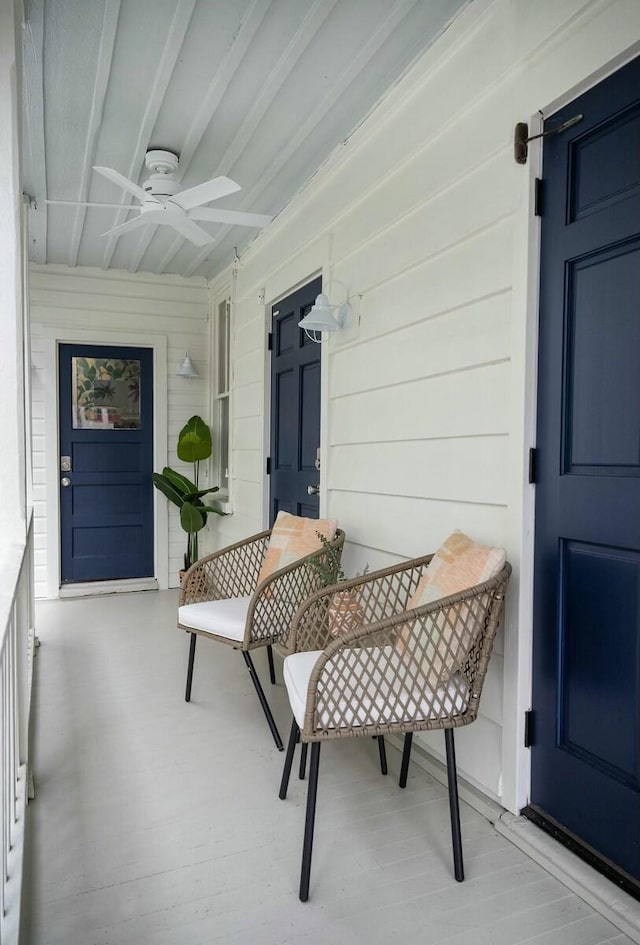 interior space with ceiling fan