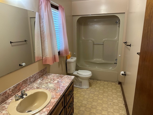 full bathroom with toilet, baseboards, shower / washtub combination, and vanity