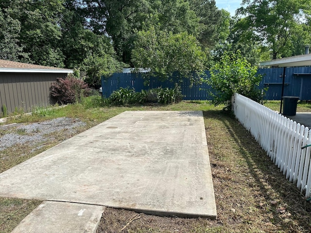 view of yard with a fenced backyard and a patio area