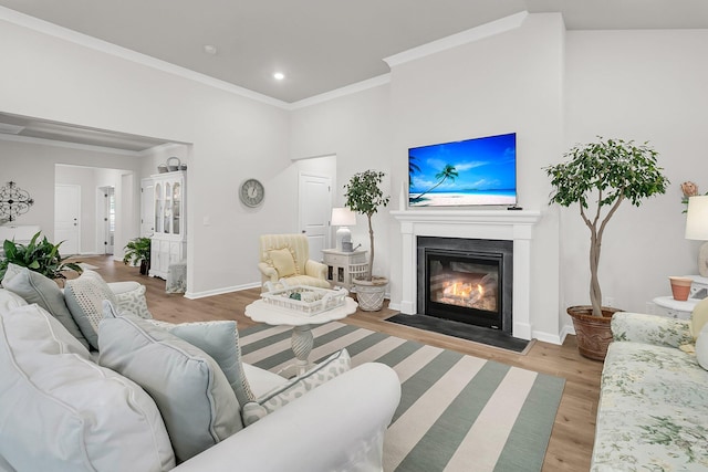 living room with wood-type flooring and ornamental molding