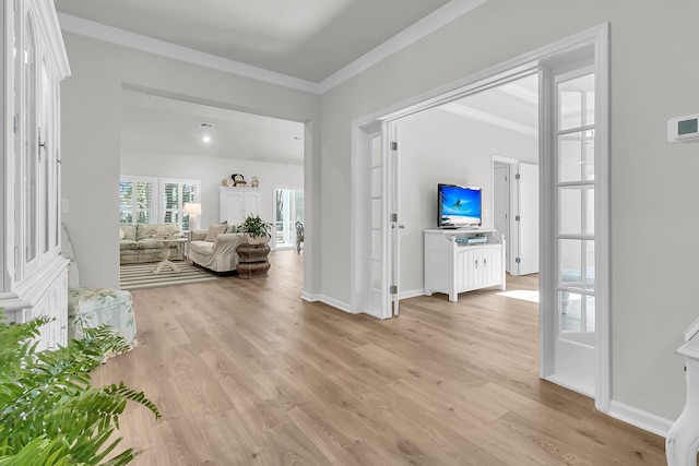 interior space featuring light hardwood / wood-style floors and ornamental molding