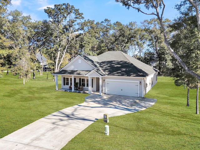 view of front of house featuring a porch, a garage, and a front yard